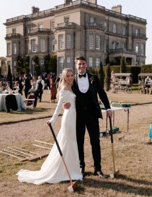 Bride and Groom playing croquet in the English country gardens at Hedsor House