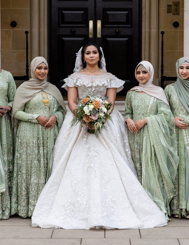 Asian Bride with bridesmaids outside Hedsor House