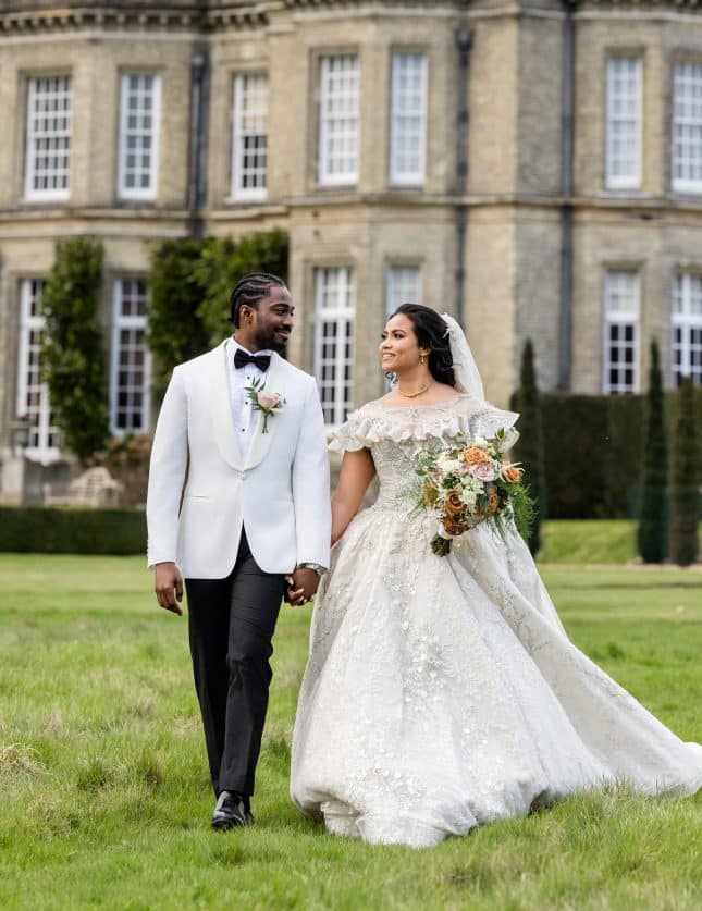 Bride and groom in grounds of Hedsor House